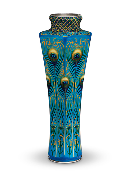 A tall vase decorated with peacock feathers